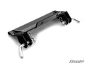 The Kawasaki Teryx KRX 1000 Plow Pro Snow Plow Mount is a black metal bracket with two angled ends, each with a silver pin and cotter pin, a central hole, triangular support plates, and the SuperATV logo on a white background.