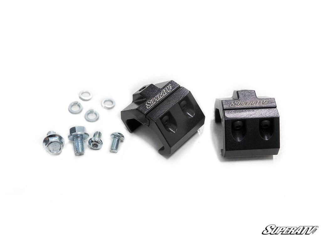 Two black Light Bracket Cage Mounts from SuperATV are displayed alongside assorted bolts, washers, and nuts on a white background. The SuperATV logo is in the bottom right corner.