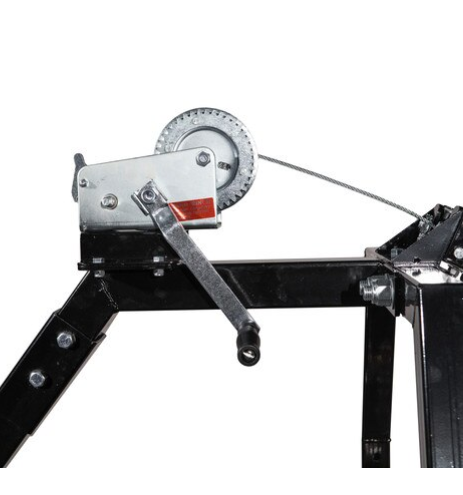 A close-up of the Log Hauler shows its metal hand winch with a crank handle, mounted on a black frame. A steel cable is wound around the winch drum and extends out of the frame against a clean white background.