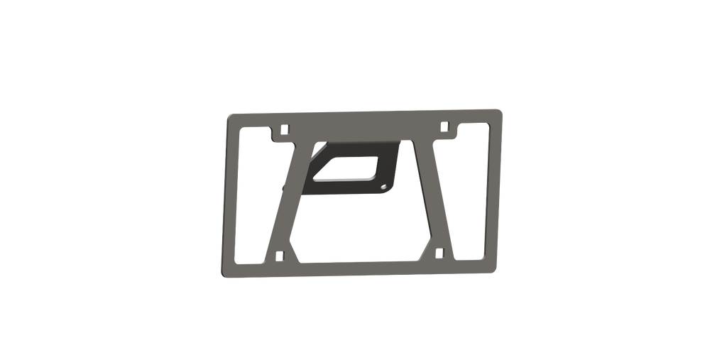 The See Treck Kitting Tab Universal Front License Plate Mount in texture black is a flat, dark gray bracket with a rectangular frame, vertical side bars, an angled center cutout, rounded corners, slots at each corner, and a central triangular cutout.
