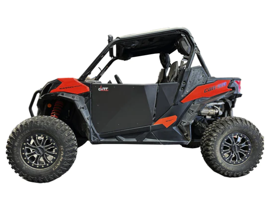 A side view of a Can Am Maverick with red and black Can Am Maverick Sport/Trail Doors, featuring large rugged tires, a roll cage, open sides, two seats, and “COMMANDER” labeled on the rear side panel for off-road adventure.