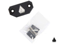 The Assault Industries Pro XP Center Mirror Mount (Fits: Polaris RZR Pro XP) is shown as a black metal plate with a geometric logo, two screw holes, a small bag with two silver screws, and a matching black mounting bracket. A small logo is in the corner.