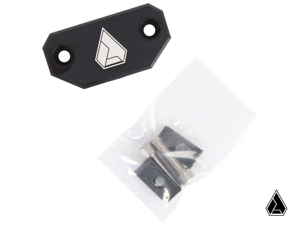 The Assault Industries Pro XP Center Mirror Mount (Fits: Polaris RZR Pro XP) is shown as a black metal plate with a geometric logo, two screw holes, a small bag with two silver screws, and a matching black mounting bracket. A small logo is in the corner.
