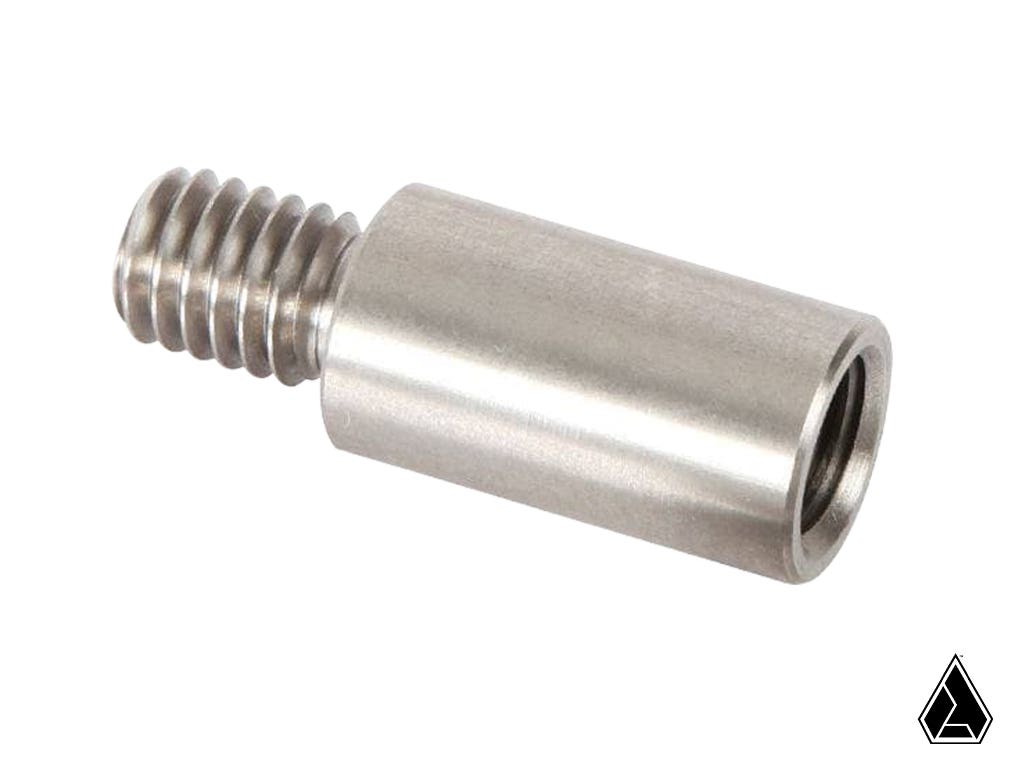The Assault Industries M10 to 3/8 Bung Adapter, made of stainless steel, has a cylindrical body with a hollow end and external screw thread. Its shown on a white background with a small black geometric logo in the corner.
