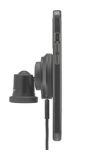 A side view of a smartphone held upright by the FLEX Mount and Charge Magnetic Wireless Charging Kit in black, with a security lock and charging cable attached, set against a plain white background.