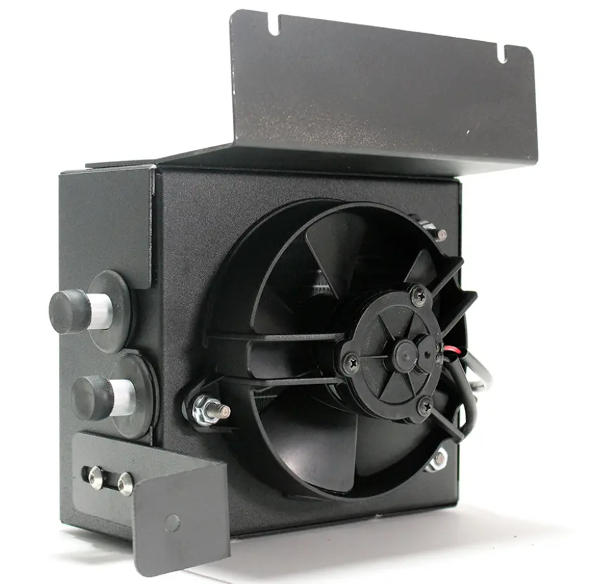 The Inferno Cab Heater Kit With Defrost for 2018-Current Can-Am Maverick Trail is a black, box-shaped unit featuring a central circular fan, metallic knobs and switches on the left, a hinged top cover, and visible wiring. It’s shown angled on white.