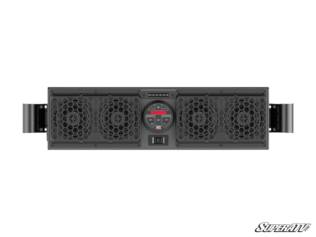 The MTX MUDSYS31 4-Speaker UTV Sound System is a rectangular black audio unit with two large round speakers on each end, honeycomb-patterned grilles, center control buttons and display, mounting brackets on both ends, and the SuperATV logo at bottom right