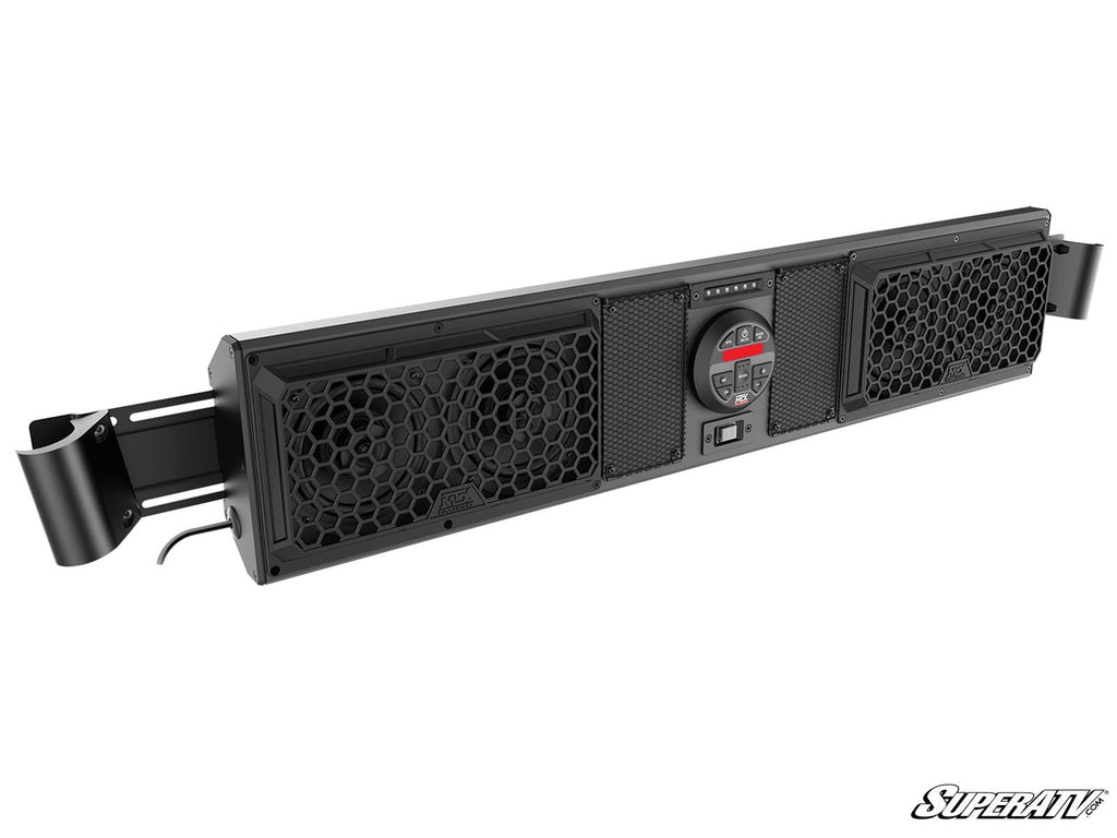 The MTX MUDSYS41 4-Speaker UTV Sound System is a black off-road soundbar featuring dual hexagonal grille speakers at each end, a central control panel with buttons and dials, and side mounting brackets; “SuperATV” logo in bottom right corner.