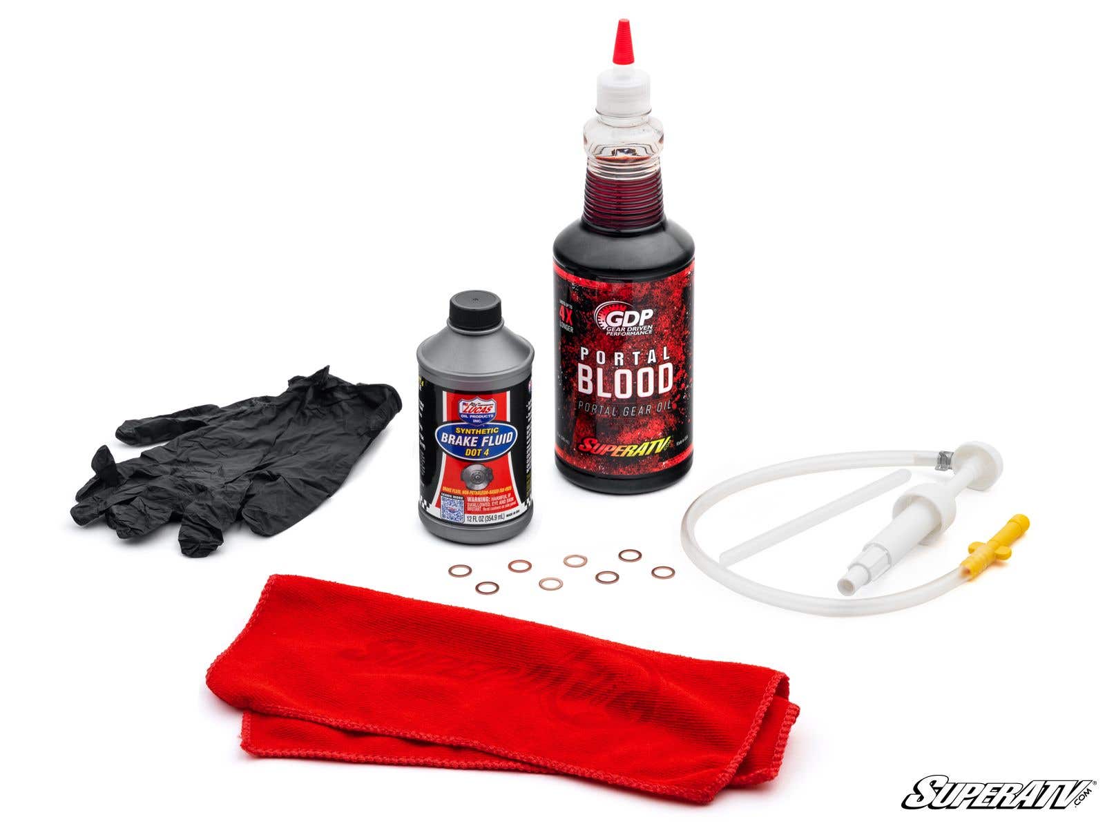 The Portal Gear Lift Install Kit includes black gloves, a small brake fluid bottle, a large Portal Blood bottle, eight copper washers, a hand pump with tubing, and two red microfiber cloths. SuperATV logo appears in the bottom right corner.