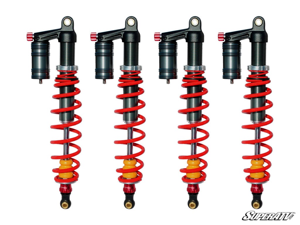 Four Phantom Pro Sport Series Piggyback Shocks for RZR S 800, featuring red springs, yellow dampers, and black canisters, are evenly spaced on a white background. Each has a metal body, adjustable parts, and SuperATV branding at bottom right.
