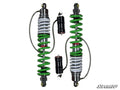 A pair of Phantom Pro Sport Series Remote Reservoir Shocks for RZR S 800 are shown side by side on a white background, featuring green and white coils, black reservoirs, silver springs, attached hoses, and the SuperATV logo in the corner.