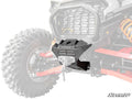 A close-up of a Polaris RZR XP Winch Mount, black and heavy-duty, installed on the front of an off-road vehicle. The centrally positioned mount shows bolts and a cable hole, with faded tires and suspension. “SuperATV” logo appears in the bottom right corn