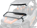 The Polaris General XP 1000 Flip-Down Glass Windshield, shown attached to an orange and black UTV with sturdy black hardware, is propped open to display venting capability. Branded seats and the protective roll cage are also visible.