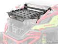 The Polaris RZR Pro R Cargo Rack Alpha, a black metal rack with circular holes, is mounted on the roof of a lime green off-road vehicle with red accents. The cargo rack is detailed; the vehicle is partially transparent. SuperATV logo at bottom right.