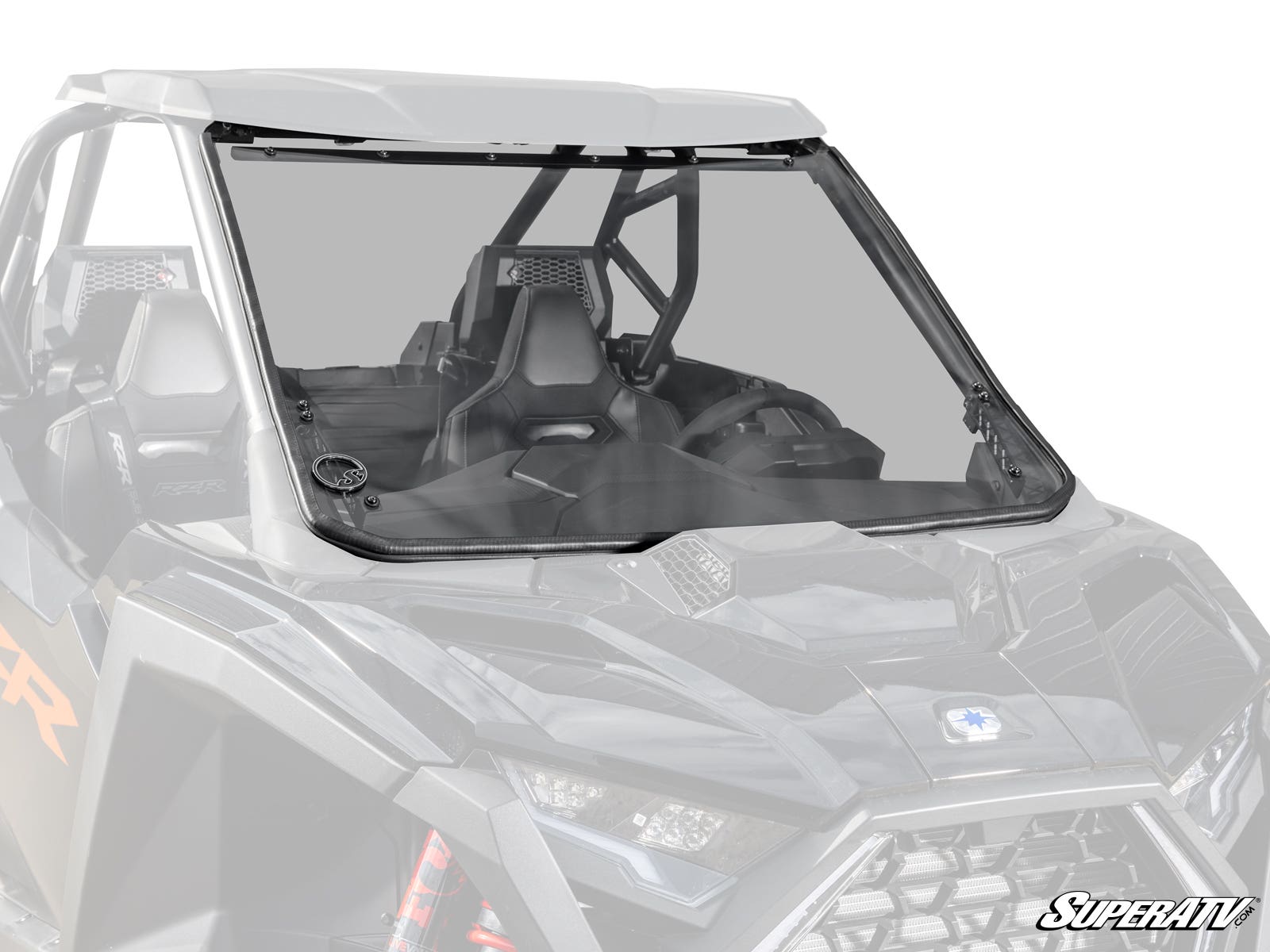 A Polaris RZR Pro S Scratch-Resistant Full Windshield is installed on a black, open-cab off-road vehicle with two bucket seats and a visible dashboard. The windshield covers the front and features the SuperATV logo in the lower right corner.
