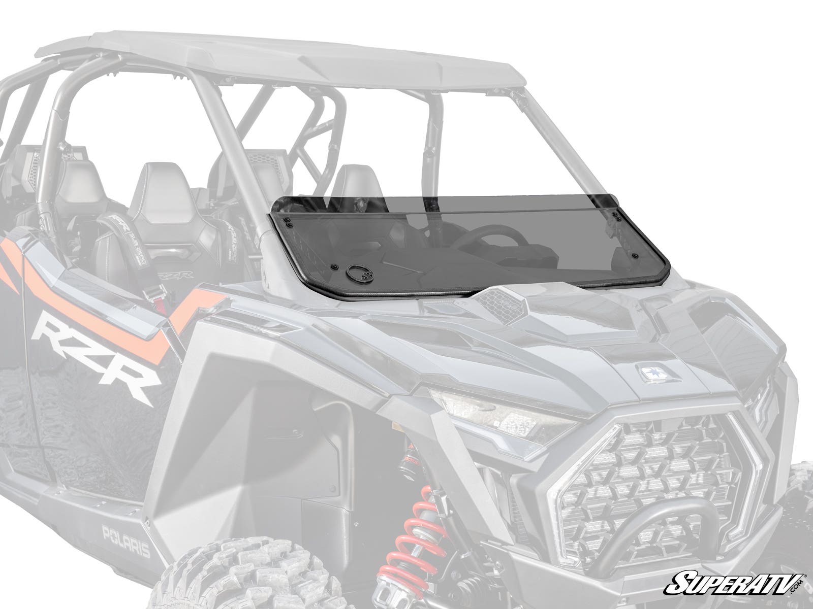 A Polaris RZR Pro S Half Windshield, tinted and mounted with visible hardware, is installed on a black and gray Polaris RZR. The half windshield covers the lower front, with the rest of the side-by-side vehicle blurred in the background.