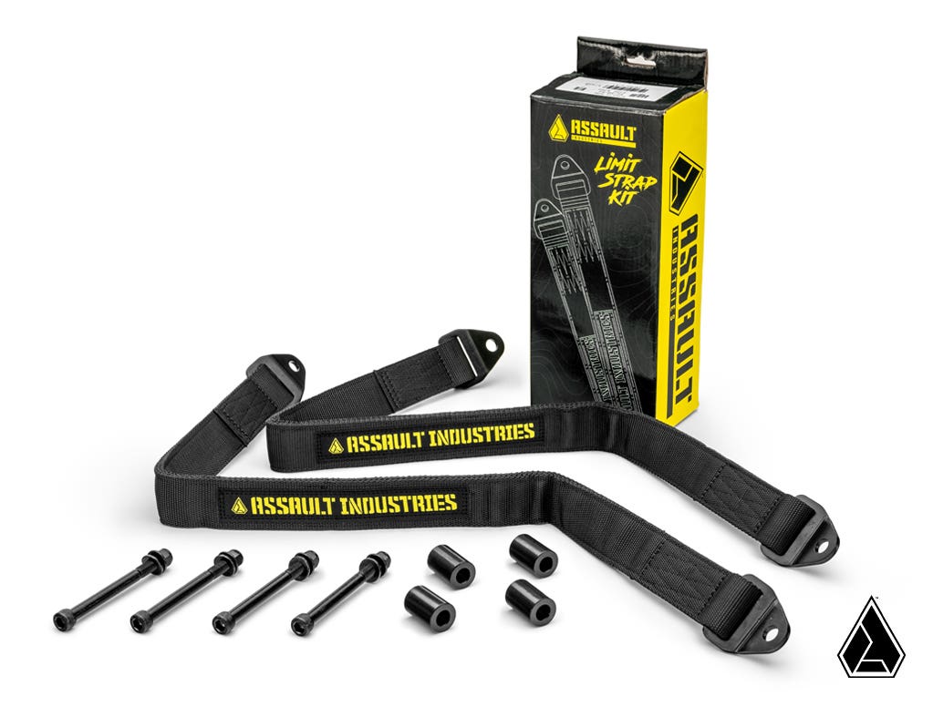 The Assault Industries Polaris RZR PRO XP Limit Straps kit includes two black straps with yellow ASSAULT INDUSTRIES text, four black bolts, four spacers, and a branded black-and-yellow box with a small Assault Industries logo.