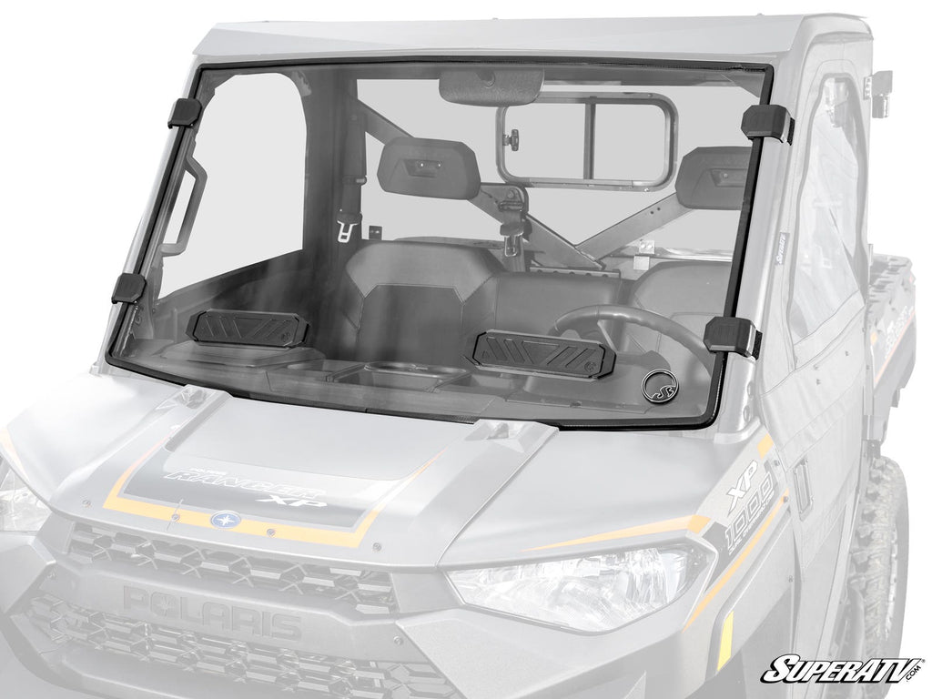 A Polaris Ranger 1000 Vented Full Windshield with black mounting brackets is installed, covering the entire front of a two-seat side-by-side. The SuperATV logo appears at the bottom right, protecting the cabin and dashboard.