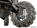 A close-up view of the Polaris Ranger XD 1500 6 Portal Gear Lift shows its large, aggressive-tread tire, detailed suspension, metal components, bolts, and protective skid plates. The SuperATV logo appears in the bottom right on a white background.