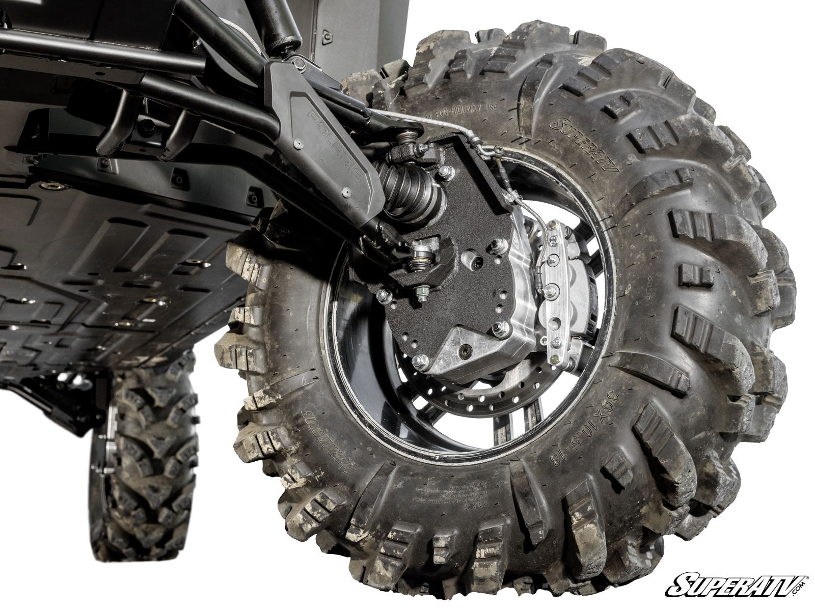 A close-up view of the Polaris Ranger XD 1500 6 Portal Gear Lift shows its large, aggressive-tread tire, detailed suspension, metal components, bolts, and protective skid plates. The SuperATV logo appears in the bottom right on a white background.