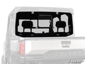 A Polaris Ranger XD 1500 Glass Sliding Rear Windshield is installed on a silver Polaris utility vehicle. It features a central sliding vent, is secured with four black brackets, and displays the SuperATV logo in the bottom right corner.