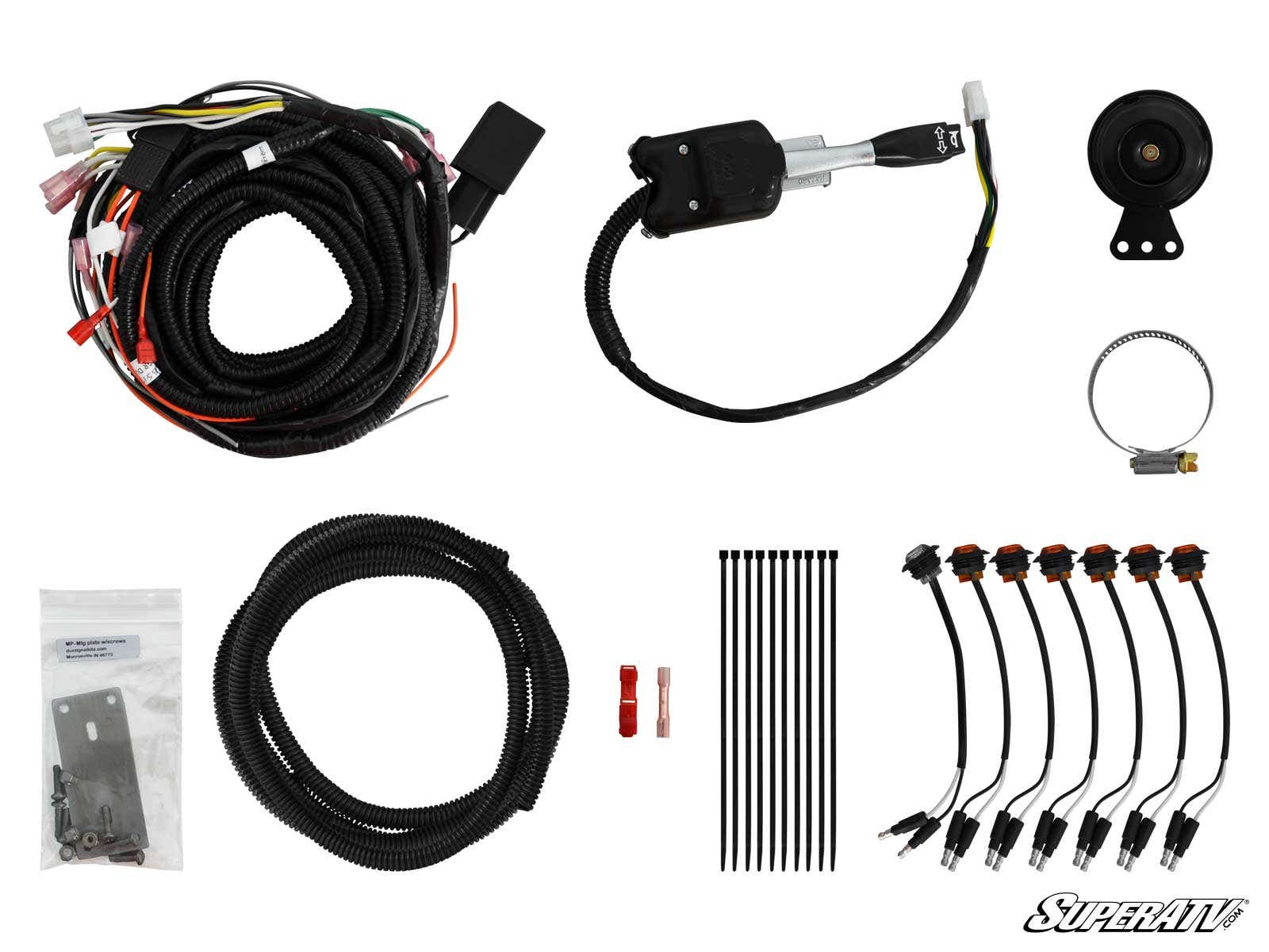 The Polaris Ranger XP 570 Plug & Play Turn Signal Kit includes coiled cables, connectors, a relay switch, horn, zip ties, metal mounting hardware, fuse, and labeled wire harnesses—all organized on a white background.