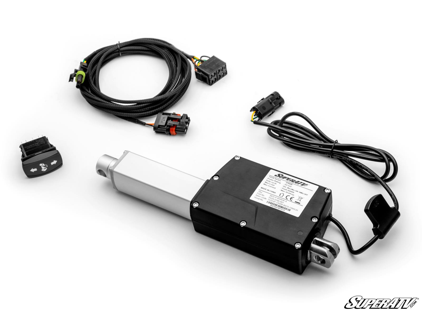 A Polaris Ranger 1000 Electric Dump Bed Kit is displayed on a white background, featuring a black-and-silver actuator, wiring harnesses with connectors, a control switch, and a cord. The SuperATV logo is visible in the bottom right corner.