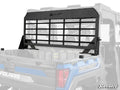 A Polaris Ranger XP Kinetic Headache Cargo Rack with horizontal black metal bars is installed behind the cab in the cargo bed of a blue Polaris Ranger, providing rear window protection. SuperATV and Polaris logos are visible.