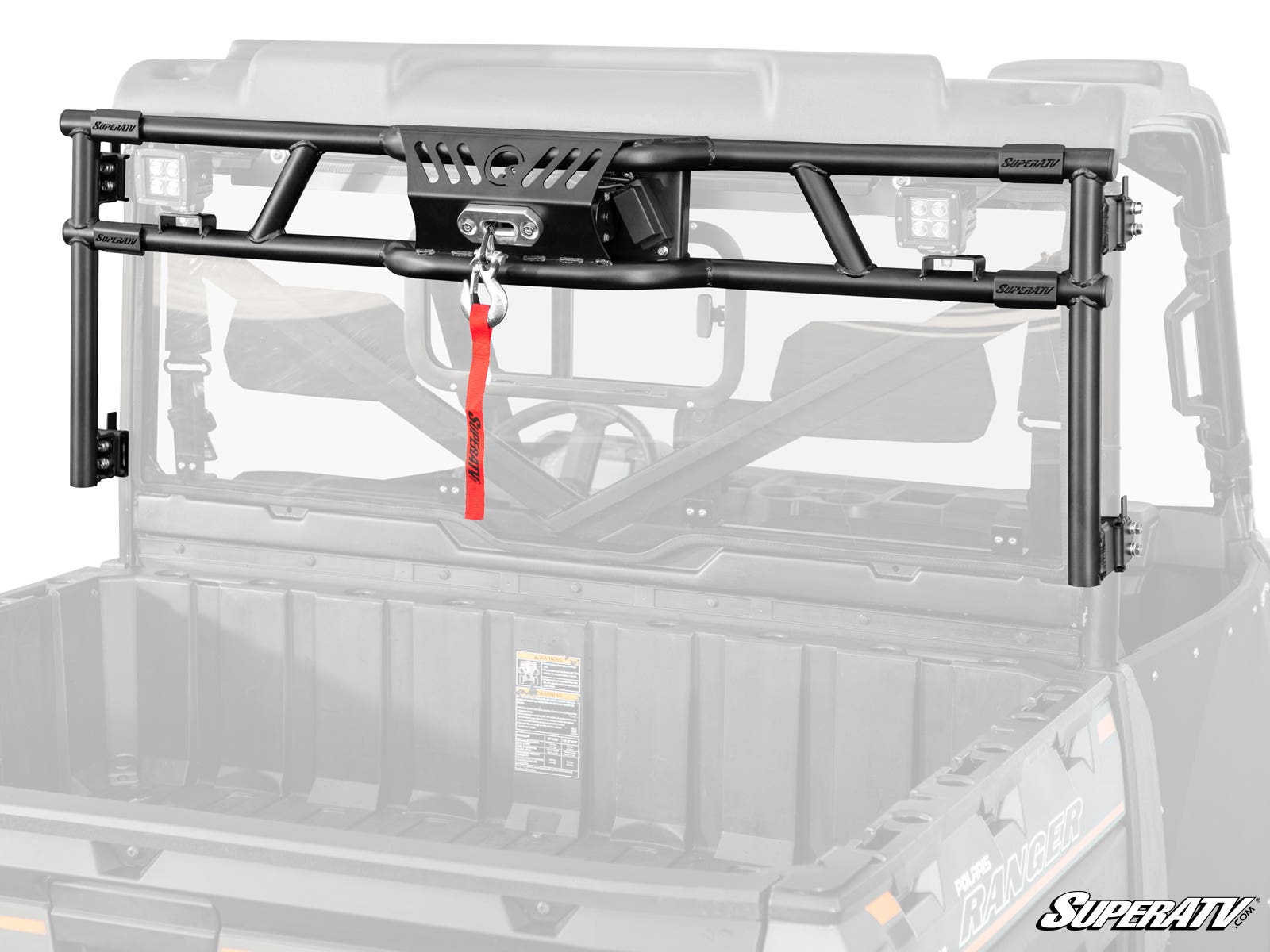 The Polaris Ranger 1000 Game Loader Rack, a black steel headache rack with a built-in winch and red strap, mounts on the UTV bed. It features side brackets, a central SuperATV logo plate, and is shown with the rear cargo bed and cab frame visible.