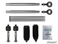 The Polaris Ranger XP Kinetic Heavy-Duty Tie Rod Kit is shown on a white background, featuring two metal rods, two rod ends, four zip ties, two tie rod ends, two rubber boots, small hardware pieces, and a SuperATV instruction manual.