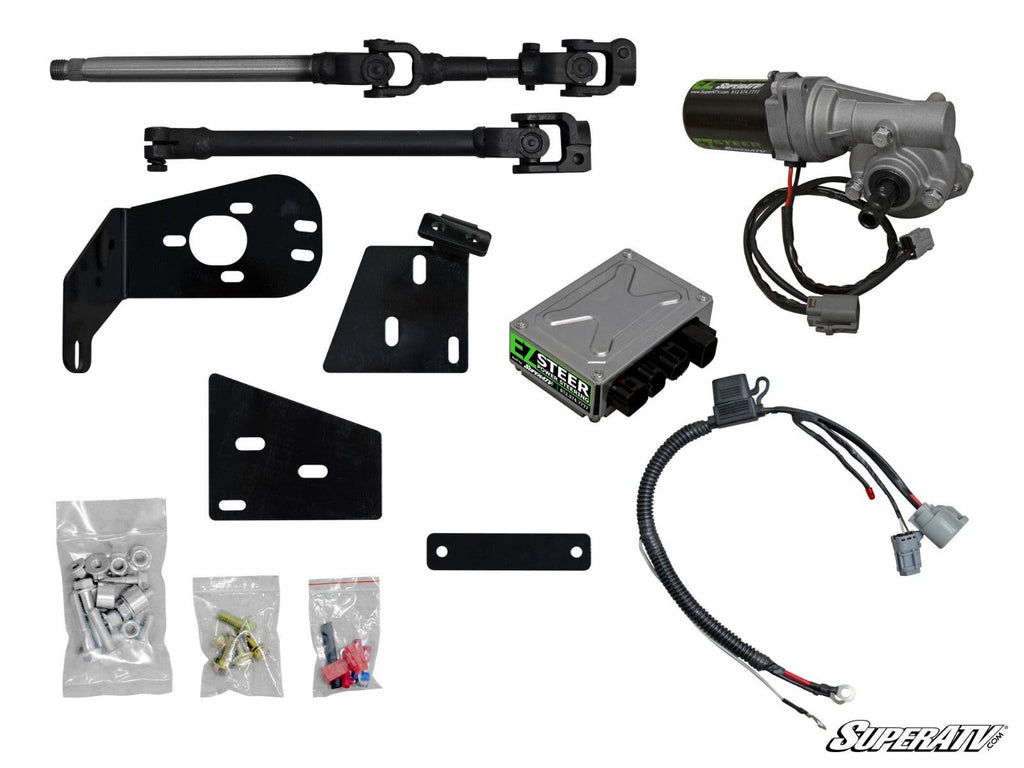 The Polaris Ranger Full Size 570 Power Steering kit is displayed on a white background, featuring a steering motor, control module, brackets, wiring harness, two steering shafts, mounting hardware, bolts, connectors, and the SuperATV logo in the corner.