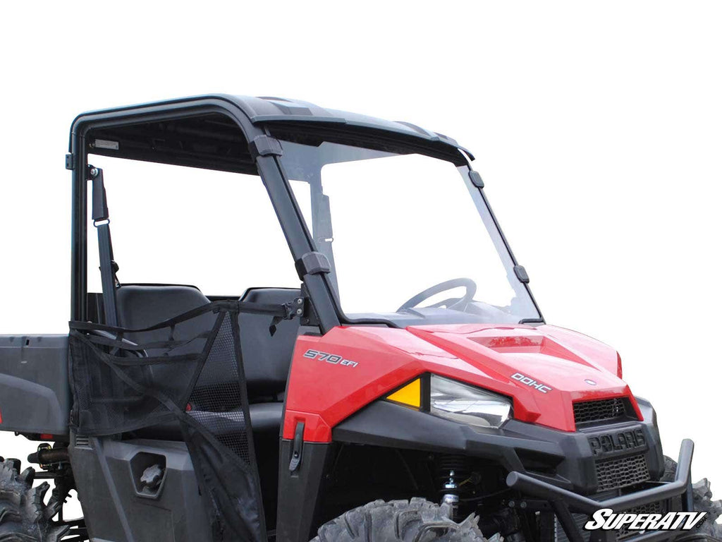 A Polaris Ranger Midsize with a full windshield, black roof, and mesh side doors is shown on a white background. It features rugged tires, two seats, side and front branding, and the SuperATV logo at the bottom right.