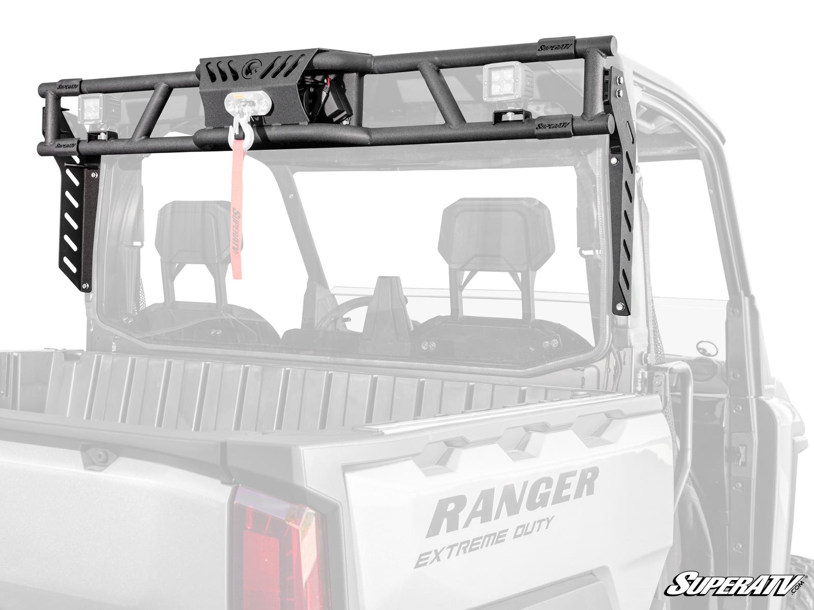 A black metal Polaris Ranger XD 1500 Game Loader Rack with a winch and pulley is mounted on a gray utility vehicle bed. The rack features angled supports, a red strap from the winch, and SUPERATV branding in the lower right corner.