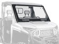 A Polaris Ranger XD 1500 Glass Windshield, featuring a clear, scratch-resistant flip-up design with black hinges and brackets, is installed on a white Polaris off-road vehicle. The SuperATV logo appears in the bottom right corner.