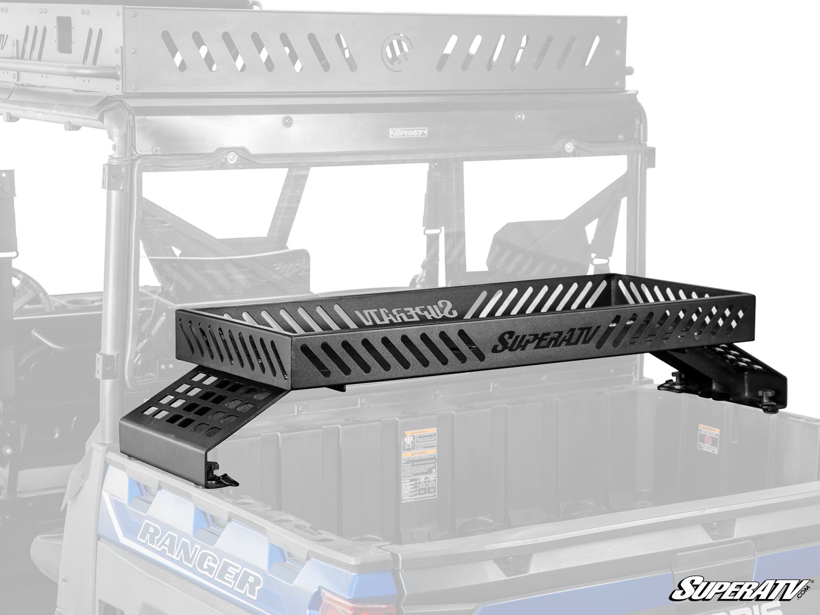 A Polaris Ranger XD 1500 Bed Rack Delta, a black metal rack with slotted ventilation holes and the SuperATV logo, is mounted on the bed of a blue Polaris Ranger utility vehicle. The scene is shown in grayscale.