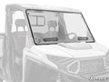 A SuperATV-branded Polaris Ranger XD 1500 Vented Full Windshield, made of clear polycarbonate with two black vents, is mounted on a white Polaris utility vehicle, covering the front cabin with seats and steering wheel visible inside.