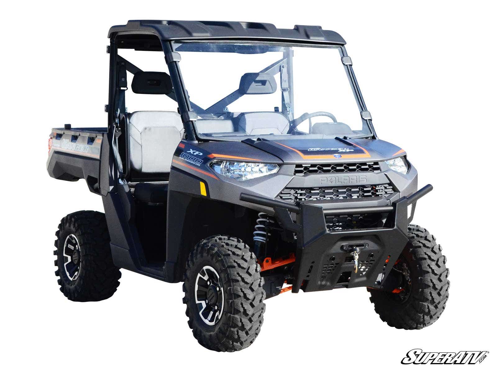 A Polaris Ranger 1000 with a full clear windshield, black body, rugged tires, protective front bumper, roof, two doors, rear cargo bed, and SuperATV branding in the bottom right corner.