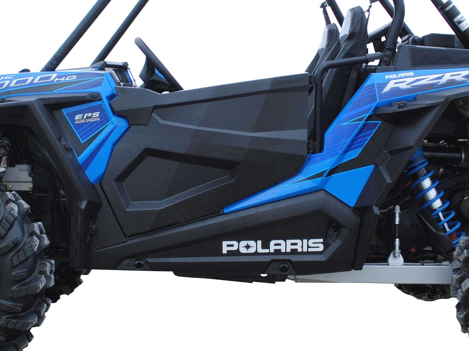 Close-up side view of a Polaris RZR S 1000 with Full Plastic Doors, showcasing the blue and black design, large rugged tire, visible Polaris logo on the lower panel, angular lines, blue suspension springs, and part of the seat.