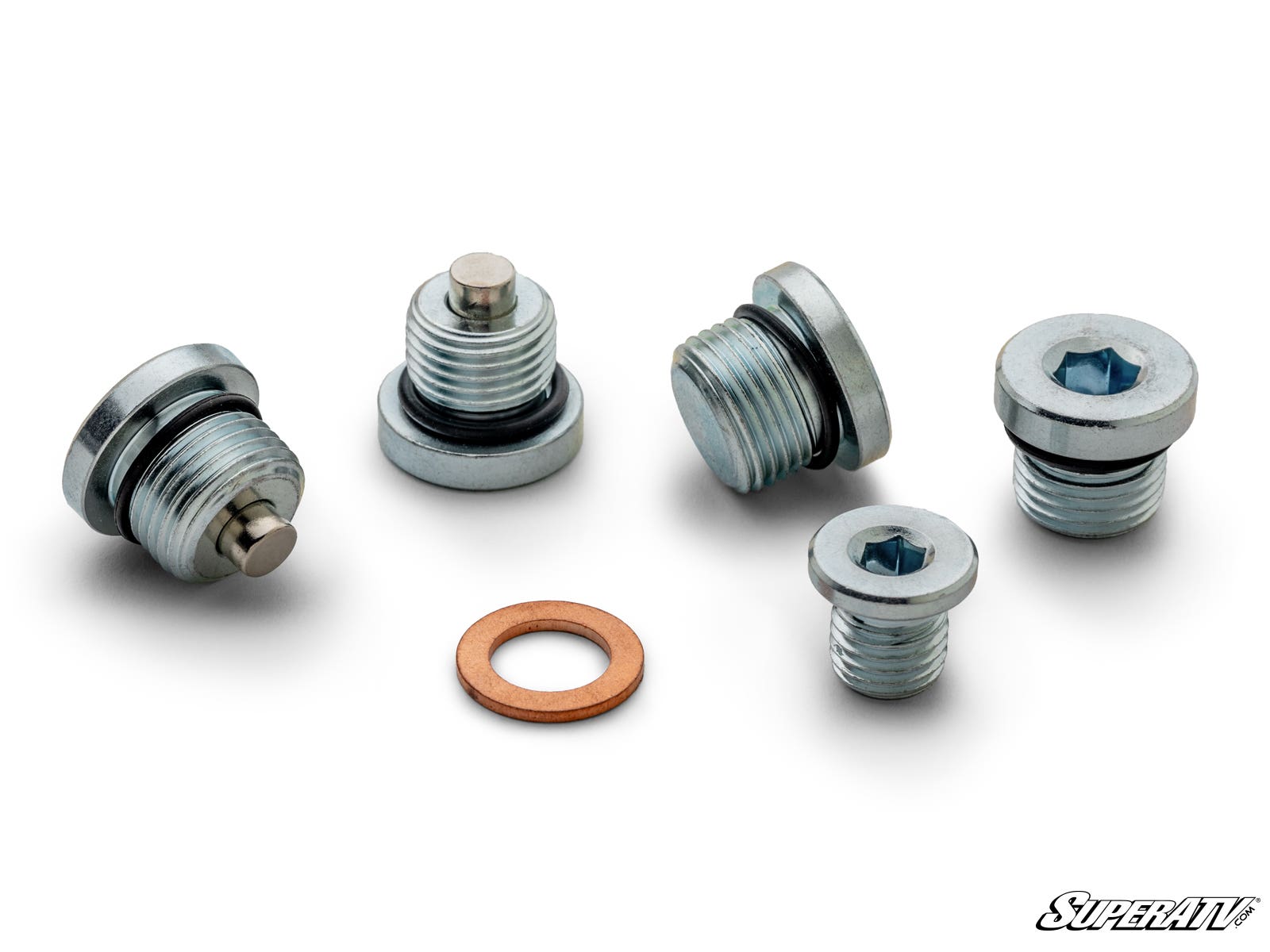 Five threaded metal plugs with hex sockets and one flat copper washer from the Up & Running Polaris Oil Plug Kit are arranged on a white surface. Two plugs feature raised central pins, three do not. The SuperATV logo is in the bottom right corner.