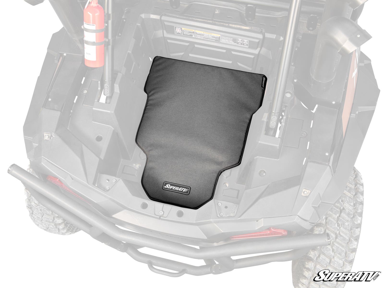 A Polaris RZR XP 1000 Padded Heat Shield, black and fitted, is installed in the rear cargo area of an off-road utility vehicle. Its centered in a rugged black plastic cargo bed with visible roll bars, a fire extinguisher, and the SuperATV logo.