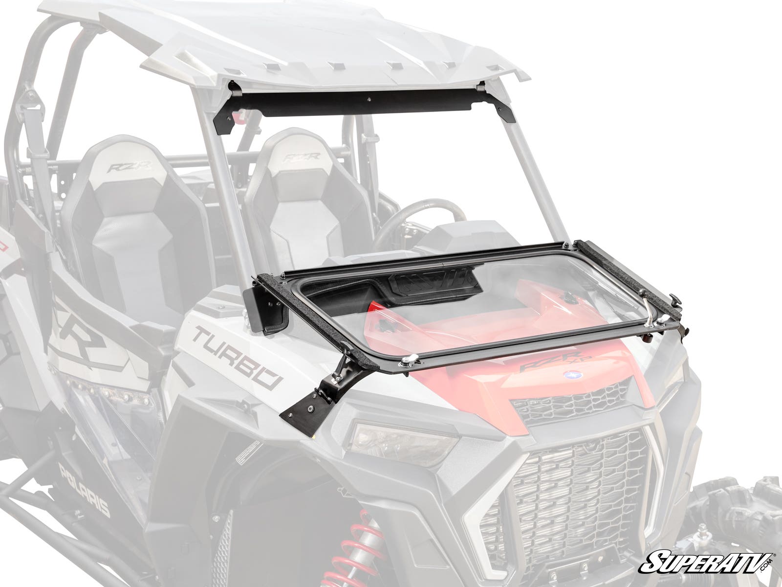 A Polaris RZR XP Turbo Flip Down Glass Windshield is installed, covering the front cabin but can be partially opened. The vehicle’s seats, steering wheel, and dashboard are visible behind the windshield. SuperATV logo appears at the bottom right.