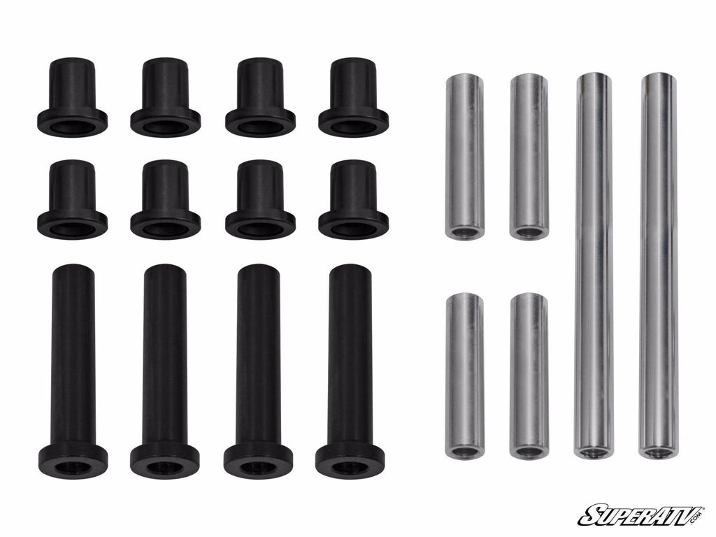 A set of twelve black cylindrical Polaris RZR XP 900 A-Arm Bushings and six metal rods—three longer black bushings and three shorter silver rods—are arranged in rows on a white background with the SuperATV logo in the bottom right corner.