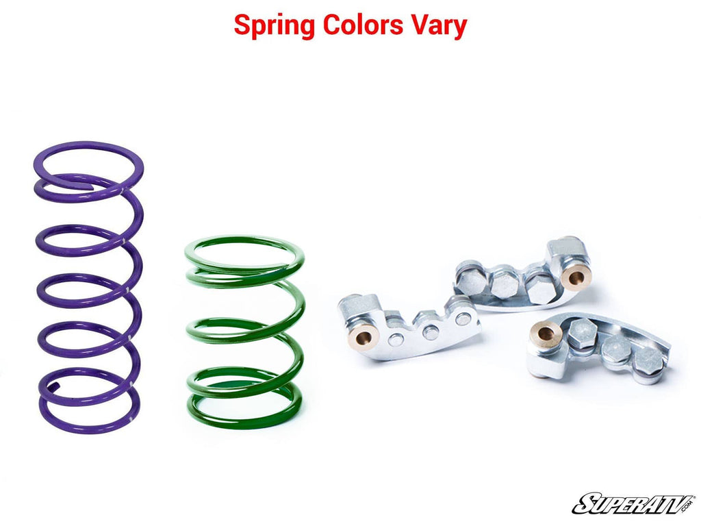 Two metal springs—one tall, purple; one short, green—are beside three silver clutch parts on a white background. Red text at the top says “Spring Colors Vary.” SuperATV logo at bottom right. Product: Polaris RZR Trail S 900 Clutch Kit.