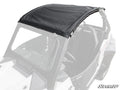 A Polaris RZR Trail S 1000 Primal Soft Top Roof in black is installed on a white off-road utility vehicle, shading the front seats and fitting snugly over the open cabin. The SuperATV logo appears in the image’s bottom right corner.