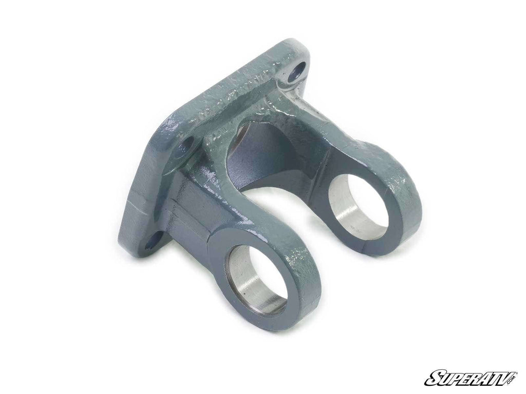 The Polaris Prop Shaft Replacement Yoke is a metal bracket with a flat base and two rounded, parallel arms, each featuring a circular opening. It has a smooth, glossy gray finish with the SuperATV logo in the bottom right corner.