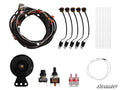 The Polaris RZR 570 Plug & Play Turn Signal Kit is displayed on a white background, featuring a coiled wiring harness, five orange and black connectors with cables, zip ties, circular horn, two toggle switches, two fuses, looped cable, and the SuperATV lo