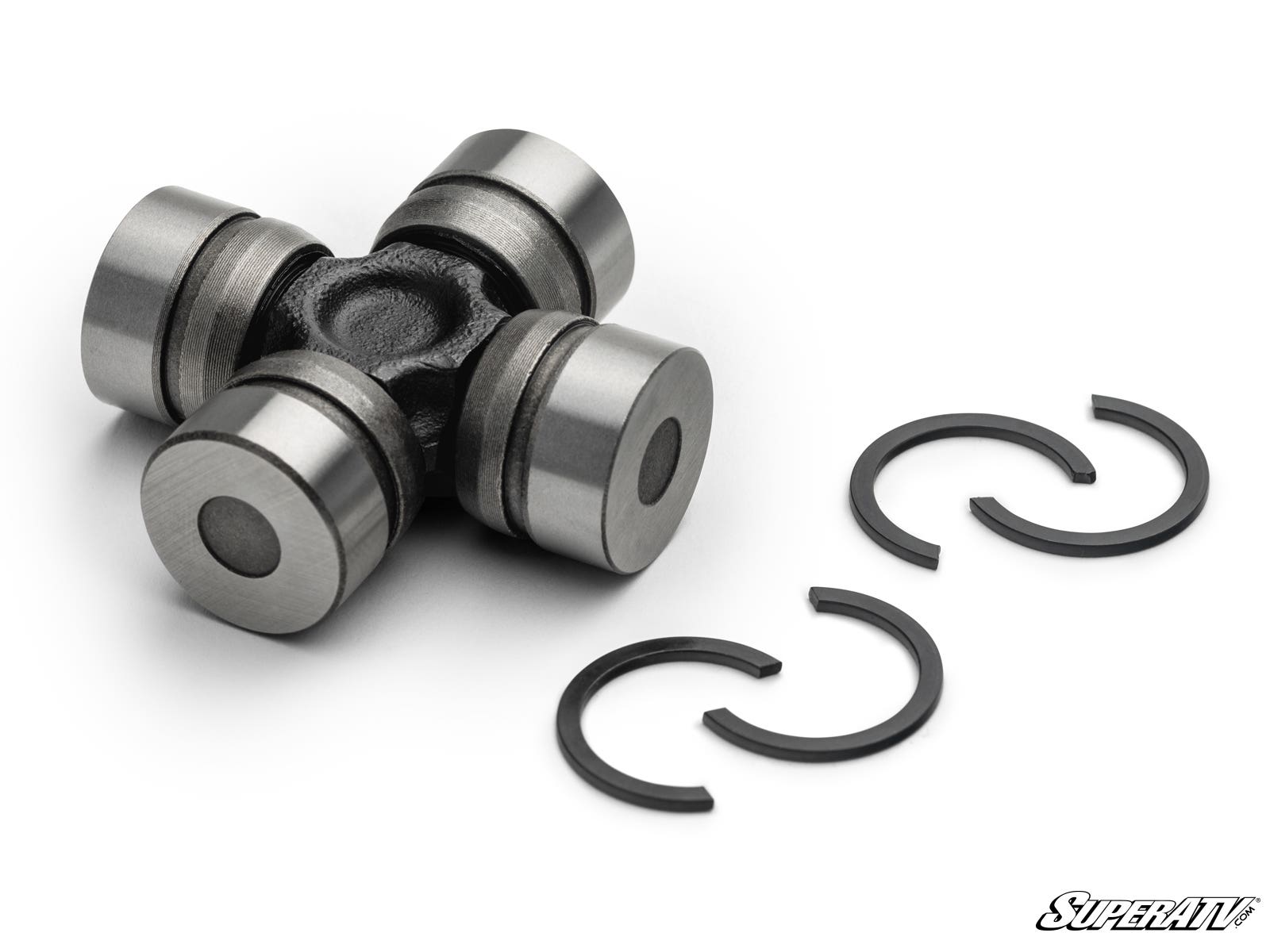 The image shows the Up & Running Polaris Replacement U-Joint, featuring four silver cylindrical ends and a dark center, next to four black circlips. The SuperATV logo appears in the lower right on a white background.