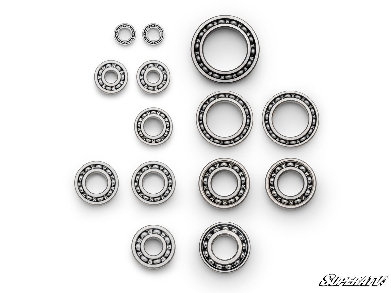 The Polaris RZR XP Turbo Premium Transmission Bearing Upgrade Kit includes thirteen metal ball bearings of various sizes, neatly arranged with visible inner and outer rings and evenly spaced metal balls. SuperATV branding appears in the bottom right corne