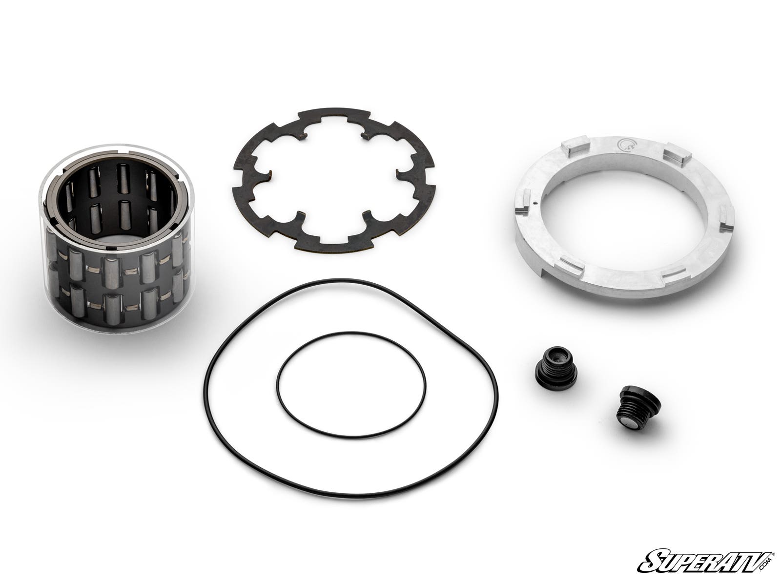 The Polaris Billet Front Differential Rebuild Kit includes a cylindrical roller bearing, two black rubber O-rings, a round metal retaining plate, a notched metal ring, and two small black threaded plugs arranged on a white background.