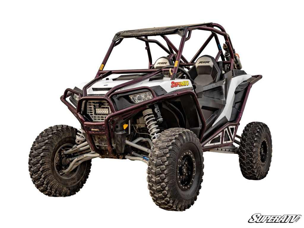 The Polaris RZR XP 1000 3-5 Lift Kit is shown on a rugged off-road utility vehicle with large knobby tires, reinforced roll cage, front bumper guard, exposed suspension, two seats, side safety nets, and SuperATV branding. White background.